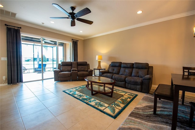 tiled living room with ornamental molding and ceiling fan