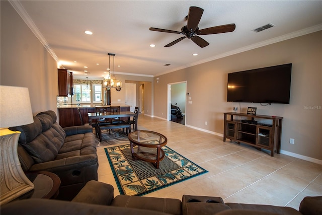 tiled living room with crown molding and ceiling fan with notable chandelier