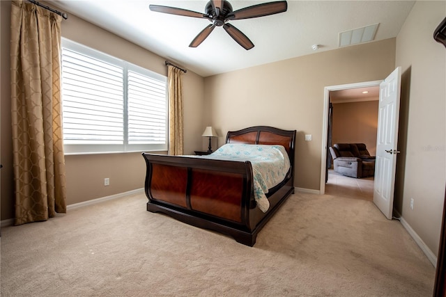 bedroom with light carpet and ceiling fan