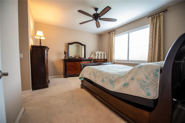 bedroom featuring ceiling fan and light colored carpet