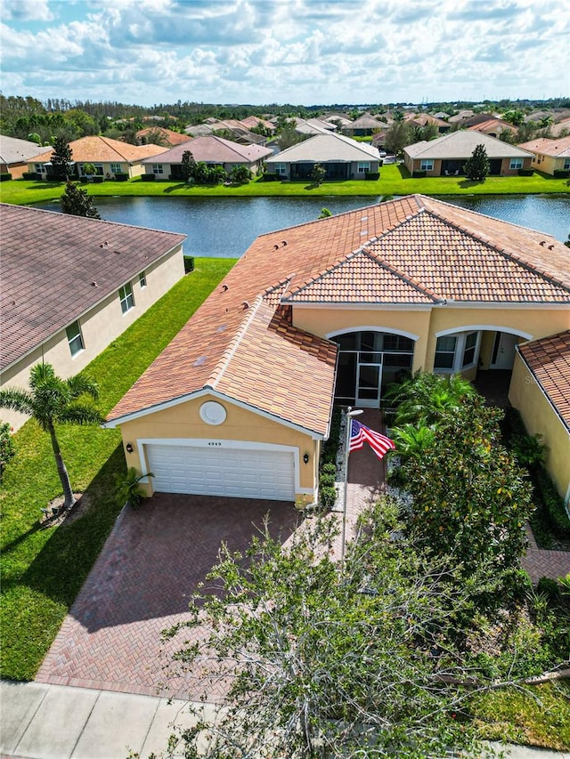 birds eye view of property featuring a water view