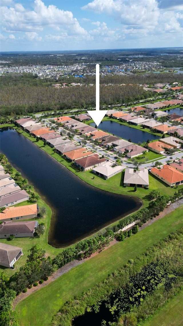 birds eye view of property featuring a water view