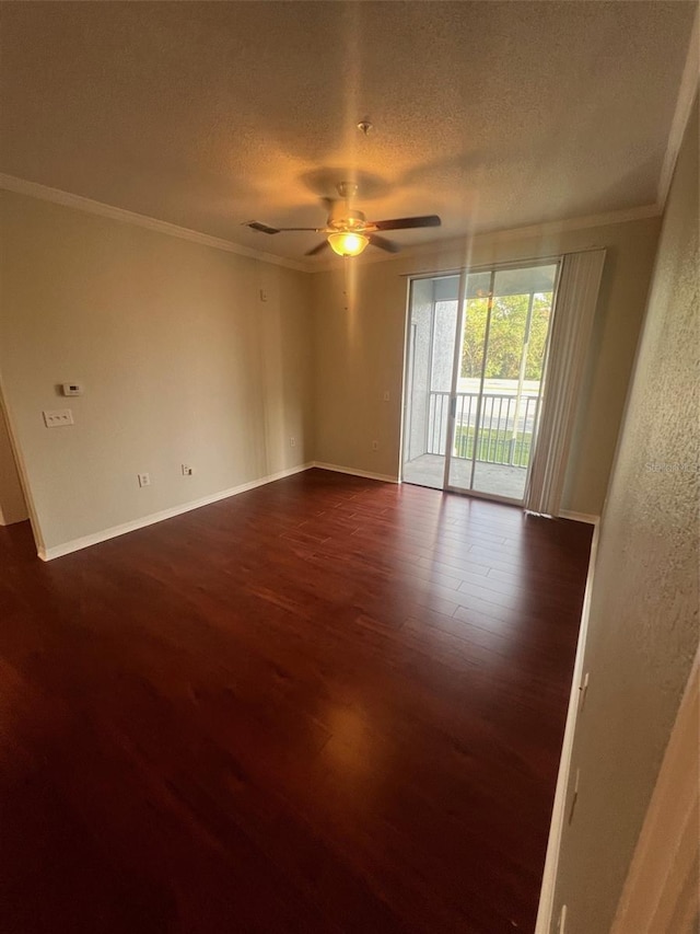 unfurnished room featuring ornamental molding, dark hardwood / wood-style flooring, a textured ceiling, and ceiling fan