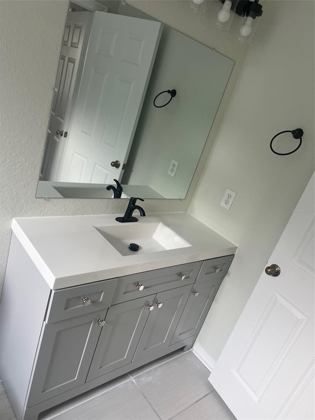 bathroom with vanity and tile patterned floors