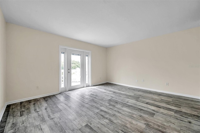 spare room with light hardwood / wood-style floors