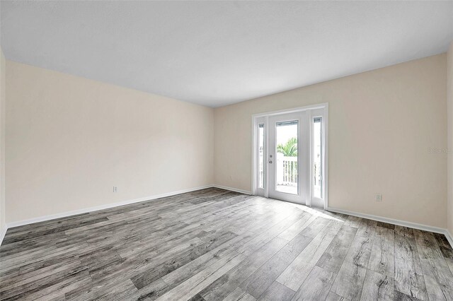 unfurnished room featuring light hardwood / wood-style flooring