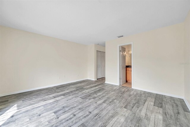 empty room with light hardwood / wood-style floors