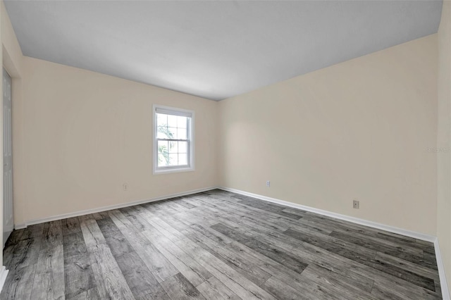 spare room with hardwood / wood-style floors