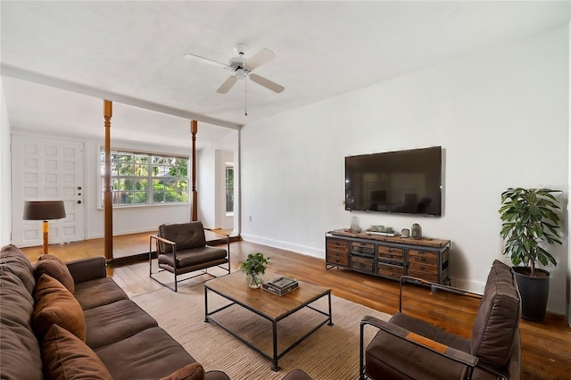 living room with ceiling fan and hardwood / wood-style flooring