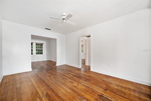 unfurnished room with ceiling fan and wood-type flooring