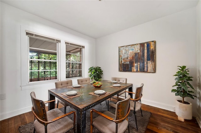 dining area featuring dark hardwood / wood-style flooring