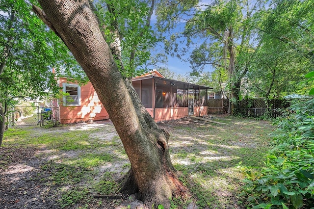 view of yard featuring a sunroom