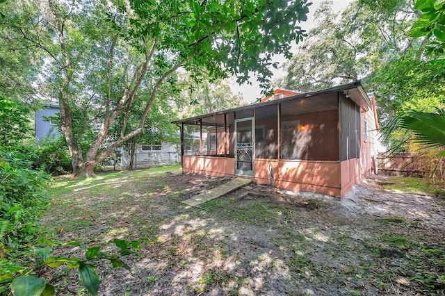 view of yard featuring a sunroom