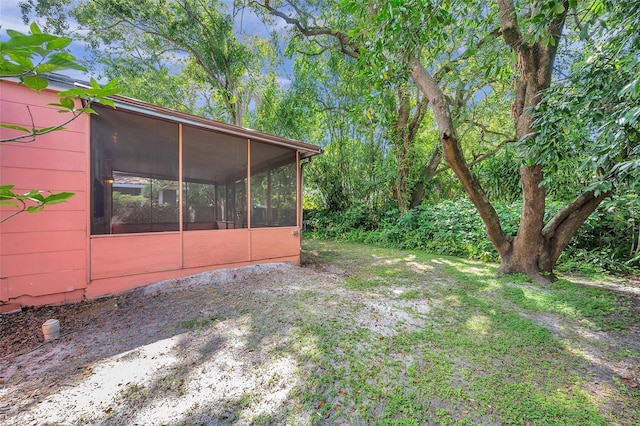 view of yard with a sunroom