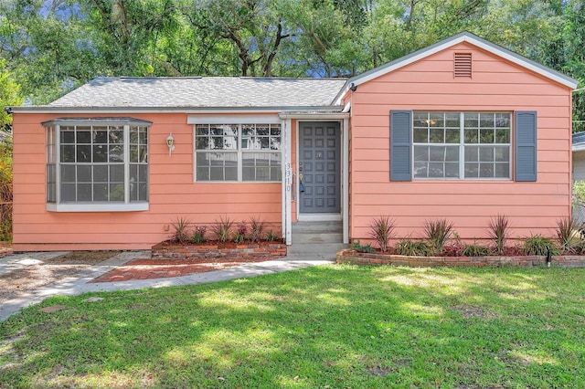 single story home with a front yard