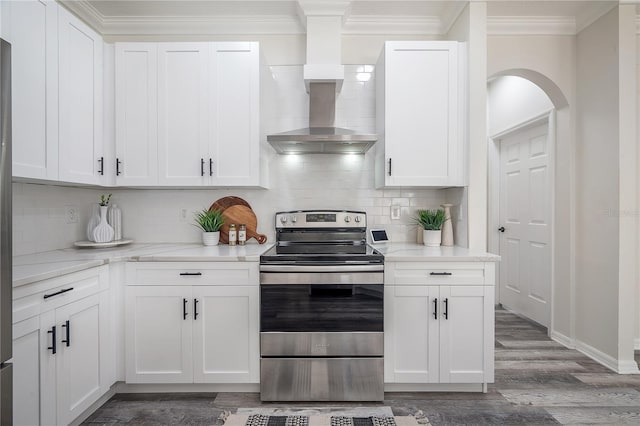 kitchen with white cabinetry, wall chimney range hood, and stainless steel electric range oven