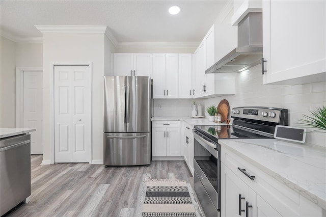 kitchen featuring white cabinetry, light hardwood / wood-style floors, stainless steel appliances, and wall chimney exhaust hood