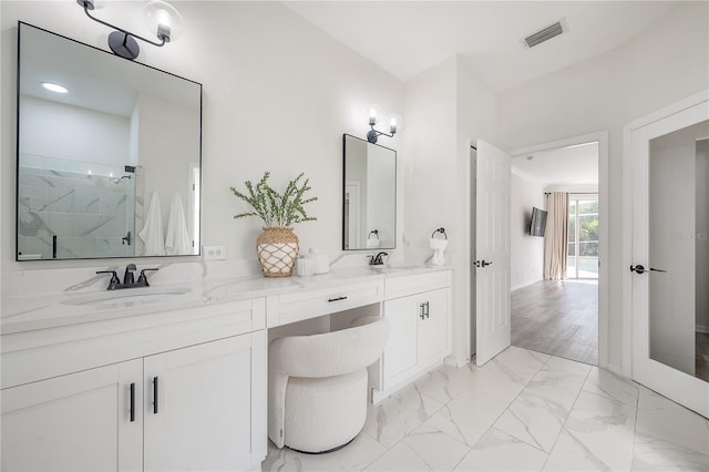 bathroom with vanity, walk in shower, and wood-type flooring