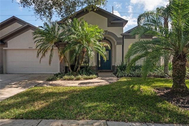 view of front facade featuring a front lawn and a garage