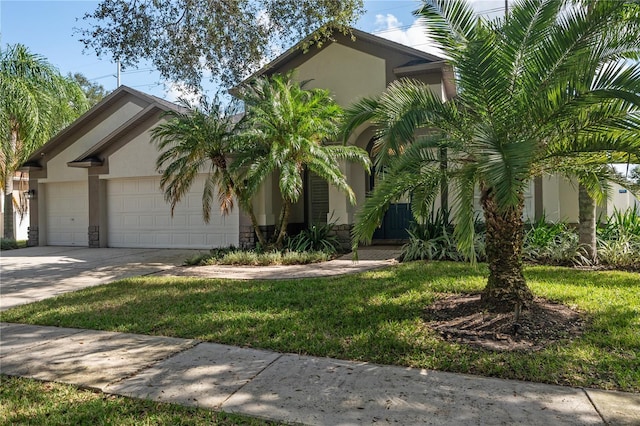 view of front facade with a front lawn and a garage