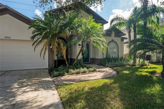 view of front of house featuring a front yard and a garage