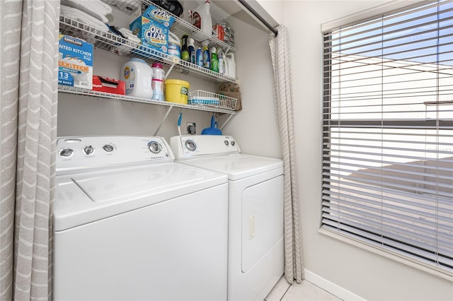 clothes washing area featuring washer and dryer