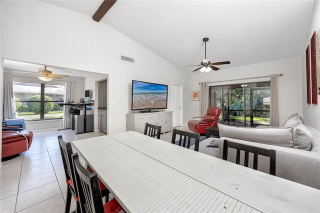 dining space with light tile patterned floors, high vaulted ceiling, a healthy amount of sunlight, and ceiling fan