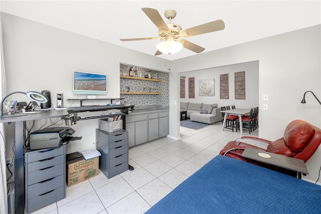 interior space featuring light tile patterned flooring and ceiling fan