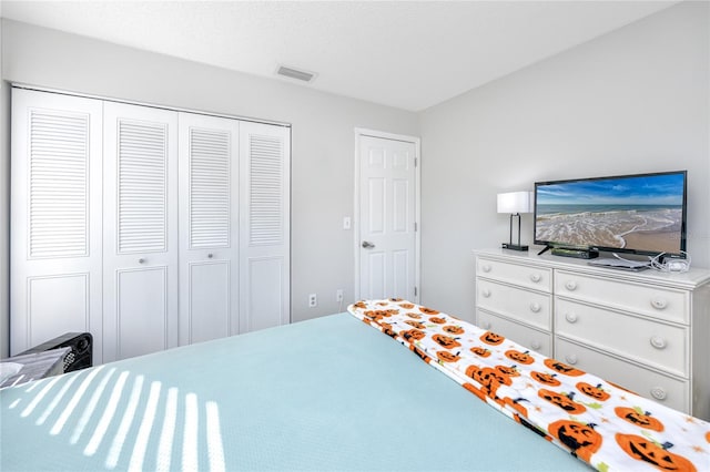 bedroom with a closet and a textured ceiling