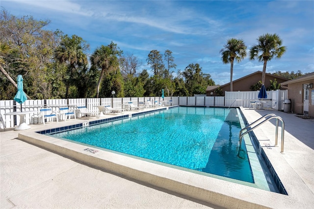 view of swimming pool with a patio