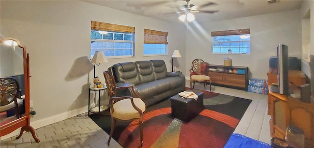 living room featuring ceiling fan and light hardwood / wood-style floors