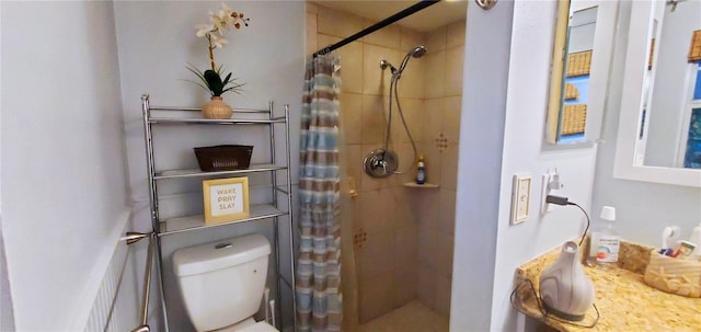 bathroom with toilet and a shower with curtain