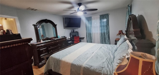 bedroom with ceiling fan and light hardwood / wood-style flooring