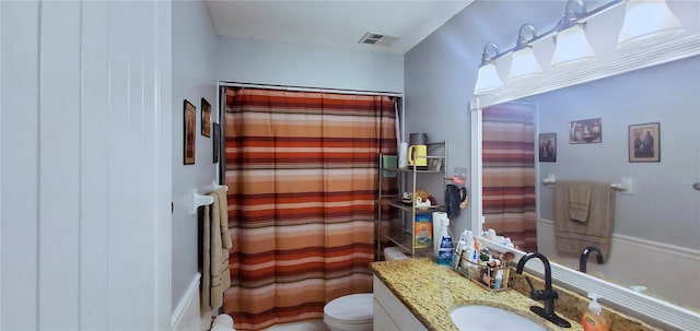 bathroom featuring vanity, a shower with curtain, and toilet