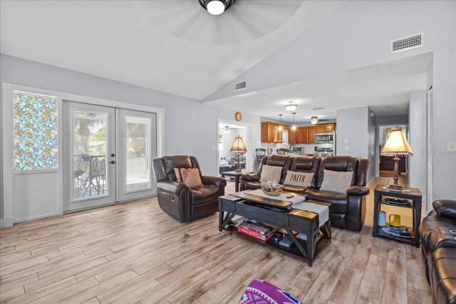 1467 Monte St, Port Charlotte, FL 33952 - living room with light wood-style floors, vaulted ceiling, and french doors