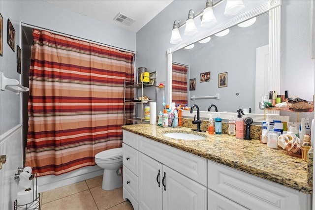 1467 Monte St, Port Charlotte, FL 33952 - bathroom featuring tile patterned floors, toilet, and vanity