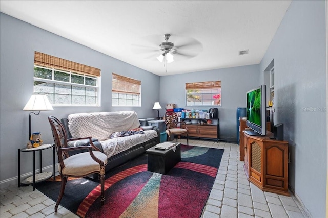 1467 Monte St, Port Charlotte, FL 33952 - living room featuring a ceiling fan and baseboards