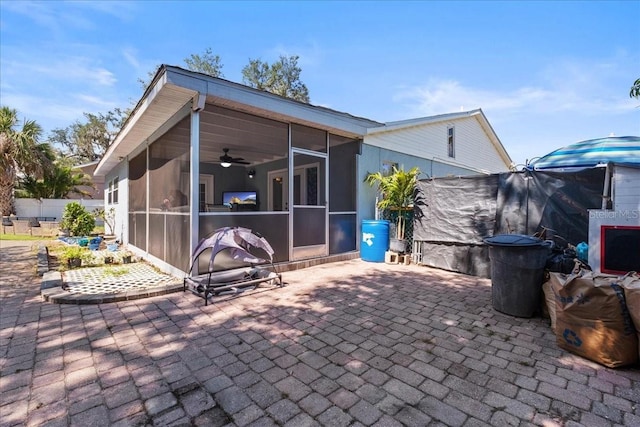 1467 Monte St, Port Charlotte, FL 33952 - view of patio / terrace with a sunroom, a ceiling fan, and fence