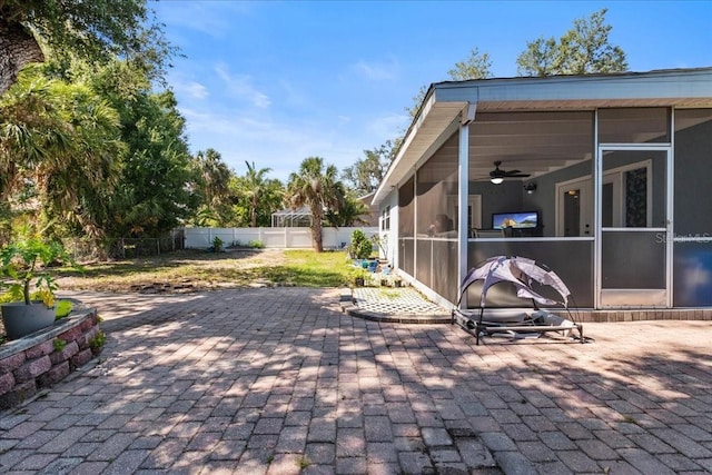 1467 Monte St, Port Charlotte, FL 33952 - view of patio featuring a sunroom, a fenced backyard, and ceiling fan