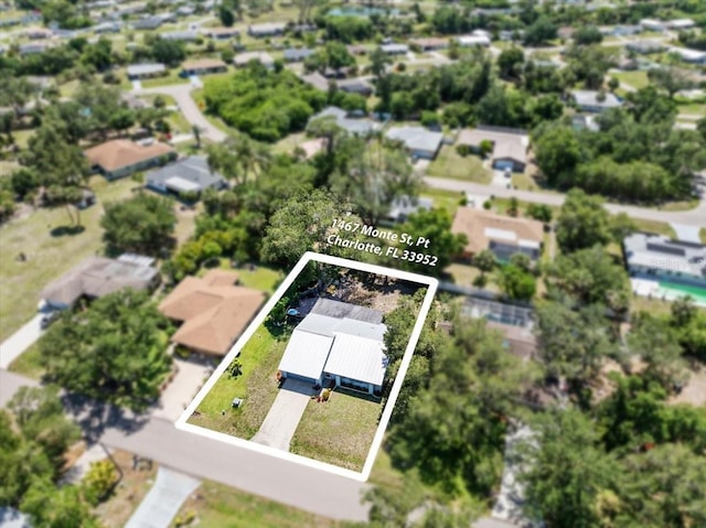 1467 Monte St, Port Charlotte, FL 33952 - aerial perspective of suburban area featuring property parcel outlined