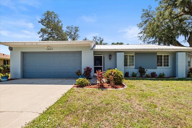 1467 Monte St, Port Charlotte, FL 33952 - single story home with an attached garage, stucco siding, a front yard, and driveway