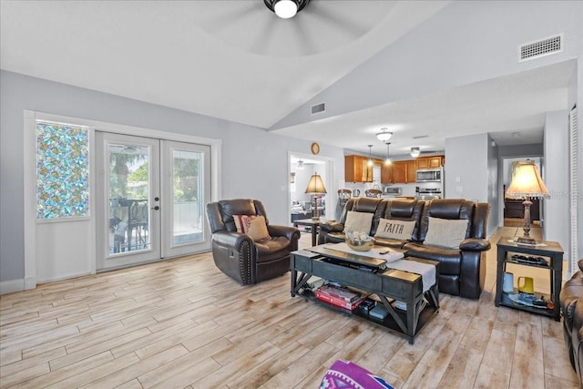 1467 Monte St, Port Charlotte, FL 33952 - living area featuring light wood-type flooring, ceiling fan, french doors, and vaulted ceiling