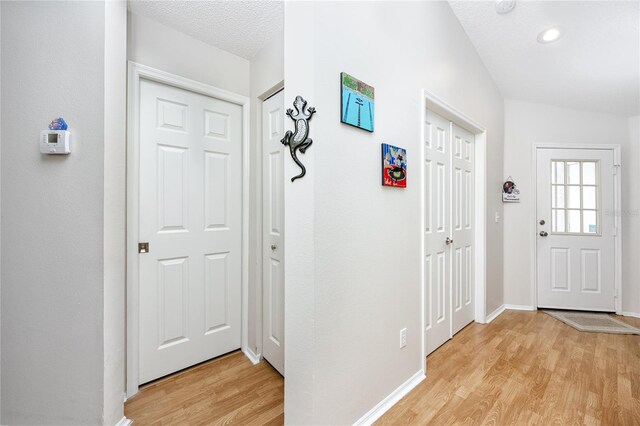 4234 Chesterfield Cir, Palm Harbor, FL 34683 - foyer featuring light wood finished floors, baseboards, and recessed lighting