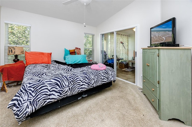 bedroom featuring light carpet, a closet, vaulted ceiling, and ceiling fan