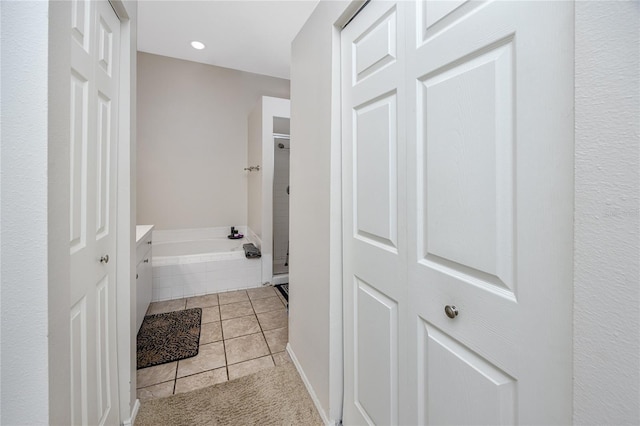 4234 Chesterfield Cir, Palm Harbor, FL 34683 - full bathroom featuring a bath, tile patterned floors, recessed lighting, vanity, and a shower