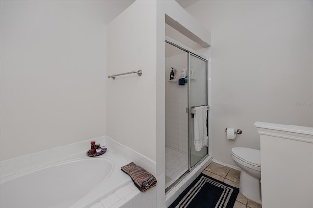 bathroom featuring toilet, independent shower and bath, and tile patterned floors