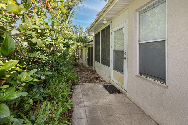 4234 Chesterfield Cir, Palm Harbor, FL 34683 - view of patio / terrace with a sunroom