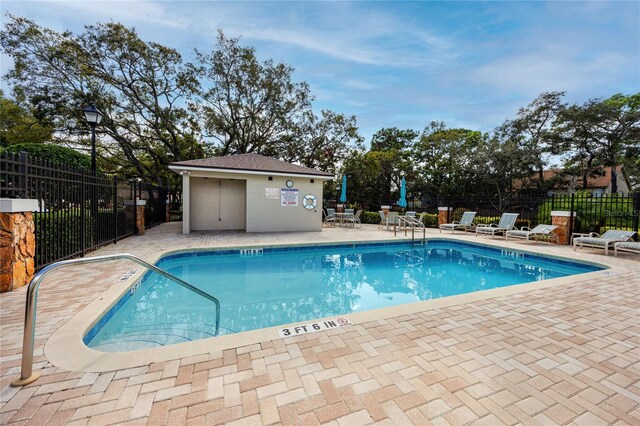 view of swimming pool with a patio area