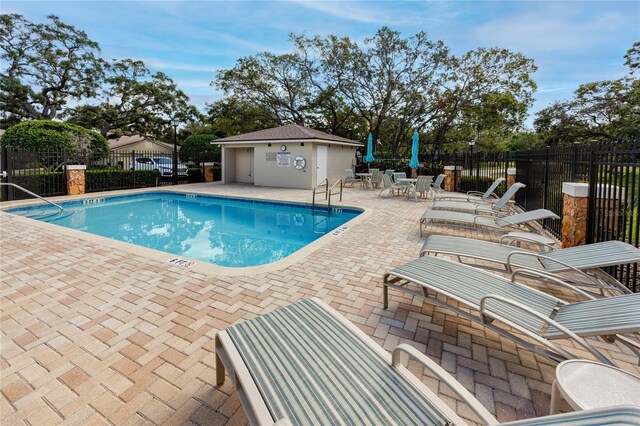 4234 Chesterfield Cir, Palm Harbor, FL 34683 - community pool with a patio area