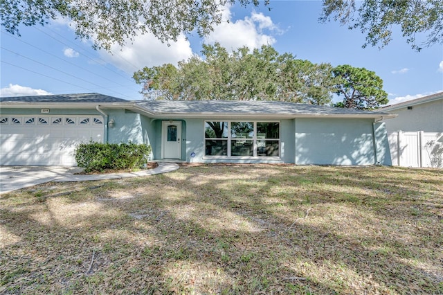 ranch-style house with a front lawn and a garage